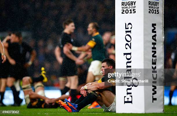 Jesse Kriel of South Africa sits dejected by the post pads at the end of the match during the 2015 Rugby World Cup Semi Final match between South...