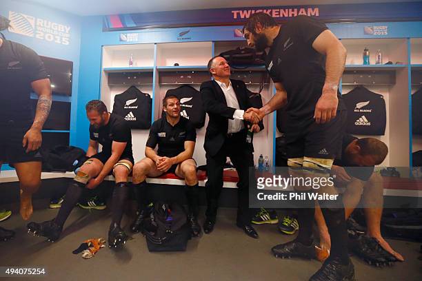 New Zealand Prime Minister John Key congratulates Samuel Whitelock in the dressing room following the 2015 Rugby World Cup Semi Final match between...