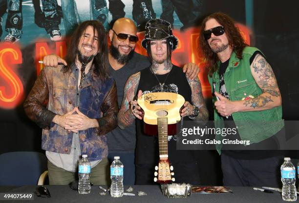 Guitarist Ron "Bumblefoot" Thal, drummer Frank Ferrer, guitarist Dj Ashba and keyboardist Dizzy Reed of Guns N' Roses attend a meet-and-greet at...