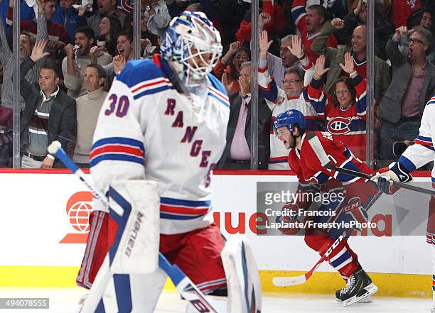 Alex Galchenyuk of the Montreal Canadiens celebrates his first period power play goal as Henrik Lundqvist of the New York Rangers looks on during...