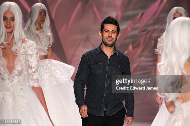 Designer Mikael D walks the runway at the Mikael D Spring/Summer 2016 fashion show during World Mastercard fashion week on October 23, 2015 at David...