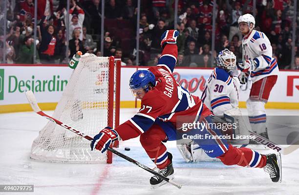 Alex Galchenyuk of the Montreal Canadiens scores the first goal on goalie Henrik Lundqvist of the New York Rangers in the first period in Game Five...