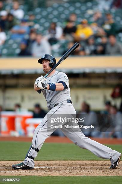 John Buck of the Seattle Mariners bats during the game against the Oakland Athletics at O.co Coliseum on May 7, 2014 in Oakland, California. The...