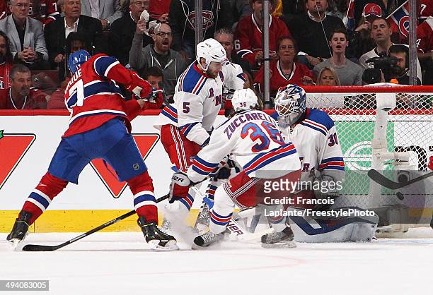 Rene Bourque of the Montreal Canadiens gires the puck past Henrik Lundqvist of the New York Rangers for second period goal at 6:54 during Game Five...