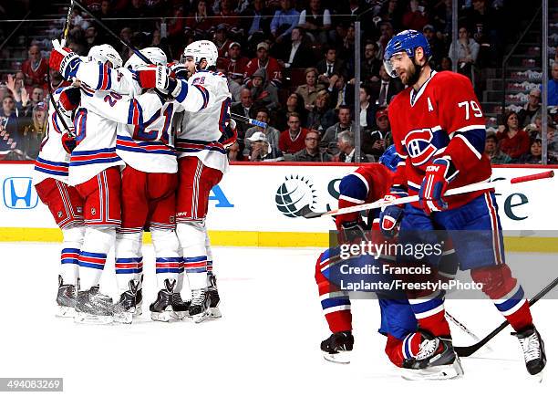 Derek Stepan of the New York Rangers celebrates his second period goal at 12:06 against the Montreal Canadiens during Game Five of the Eastern...