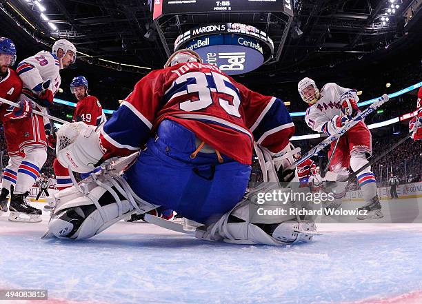 Derek Stepan of the New York Rangers fires the puck past Dustin Tokarski of the Montreal Canadiens for a second period goal at 12:06 during Game Five...