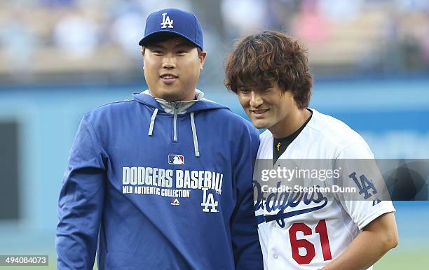 Pitcher Hyun-Jin Ryu of the Los Angeles Dodgers poses with fellow Korean and former Dodger pitcher Chan Ho Park after park threw out the first pitch...