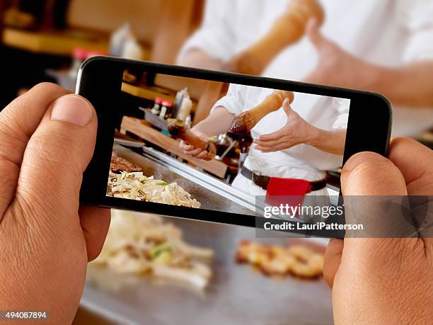 mobile photography at a japanese restaurant - teppanyaki stock pictures, royalty-free photos & images