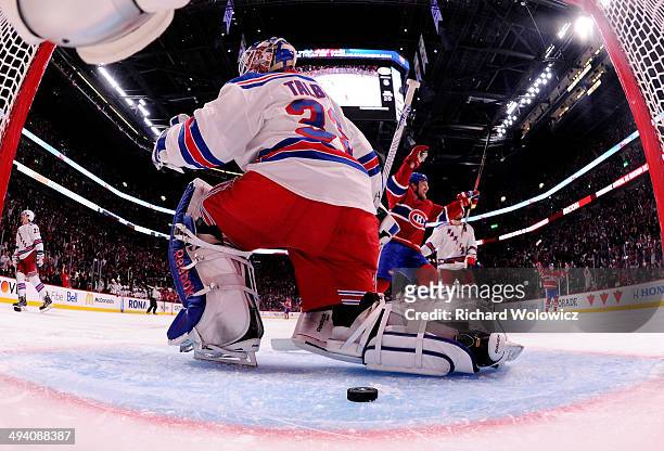 Cam Talbot of the New York Rangers looks on after giving up a third period goal to Rene Bourque of the Montreal Canadiens at 6:33 during Game Five of...