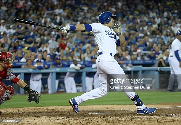 Andre Ethier of the Los Angeles Dodgers hits a three run triple in the fourth inning against the Cincinnati Reds at Dodger Stadium on May 27, 2014 in...