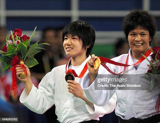 Bronze medalist Misato Nakamura of Japan poses with her medal in the medal ceremony for the Judo Women's -52kg at the University of Science and...