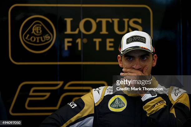 Pastor Maldonado of Venezuela and Lotus yawns as he stands in the garage after qualifying was suspended due to bad weather for the United States...
