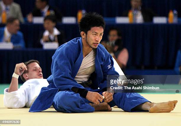Yusuke Kanamaru of Japan reacts after losing to Dirk van Tichelt of Belgium in the Judo Men's -73kg Repechage semi final at the University of Science...