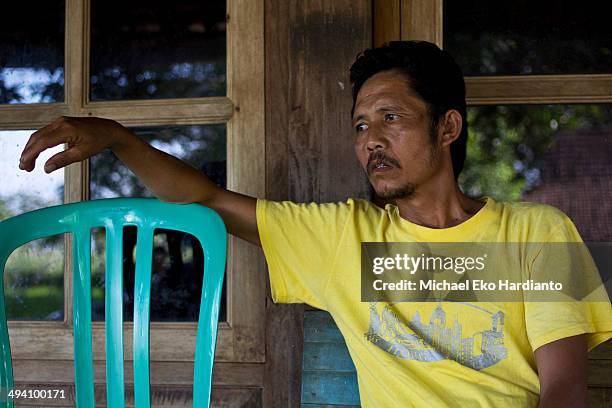 Erwiana's father, Rohmad Saputro relaxes at his home on May 27, 2014 in Ngawi, Indonesia. Erwiana Sulistyaningsih has been voted one of 100 most...