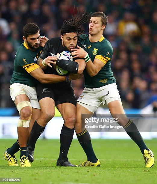 Damian de Allende of South Africa and 2 of South Africa tackle Ma'a Nonu of New Zealand during the Rugby World Cup Semi Final match between South...