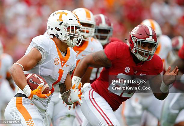 Jalen Hurd of the Tennessee Volunteers rushes against Ryan Anderson of the Alabama Crimson Tide at Bryant-Denny Stadium on October 24, 2015 in...