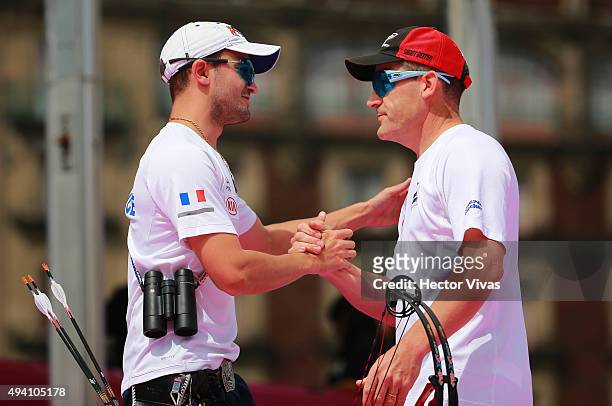 Sebastien Peineau greets Dominique Genet of France during the compound men's individual competition as part of the Mexico City 2015 Archery World Cup...
