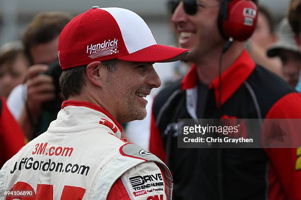 Jeff Gordon, driver of the 3M Chevrolet, and his crew chief Alan Gustafson look on after qualifying on the pole for the NASCAR Sprint Cup Series...