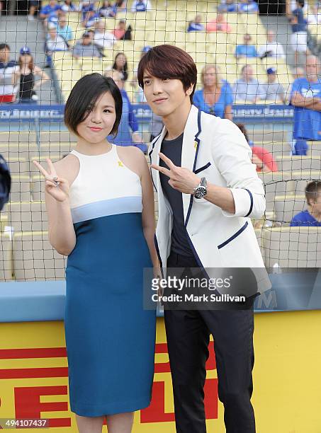 Korean singers Cho Yong Jin, aka ALi and Jung Yong-hwa before the game between the Los Angeles Dodgers and Cincinnati Reds on May 27, 2014 in Los...