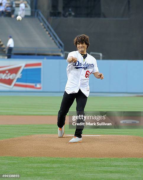 Former Los Angeles Dodger pitcher Chan Ho Park throws out the ceremonial first pitch before the game between the Los Angeles Dodgers and Cincinnati...