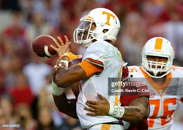 Ryan Anderson of the Alabama Crimson Tide forces a turnover as he tackes Joshua Dobbs of the Tennessee Volunteers in the final seconds of their 19-14...