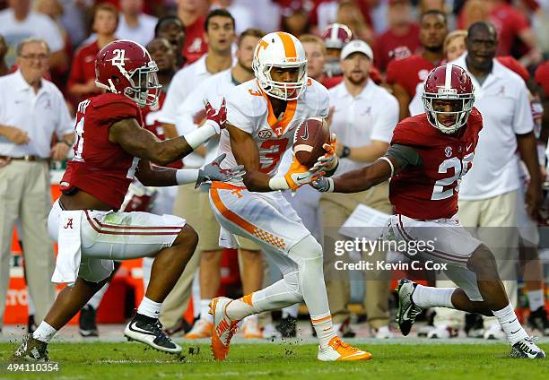 Josh Malone of the Tennessee Volunteers pulls in this reception against Maurice Smith and Marlon Humphrey of the Alabama Crimson Tide at Bryant-Denny...