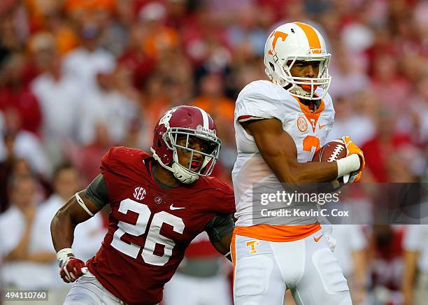 Josh Malone of the Tennessee Volunteers pulls in this reception against Marlon Humphrey of the Alabama Crimson Tide at Bryant-Denny Stadium on...