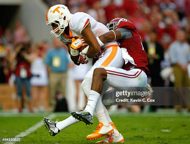 Josh Malone of the Tennessee Volunteers pulls in this reception against Marlon Humphrey of the Alabama Crimson Tide at Bryant-Denny Stadium on...