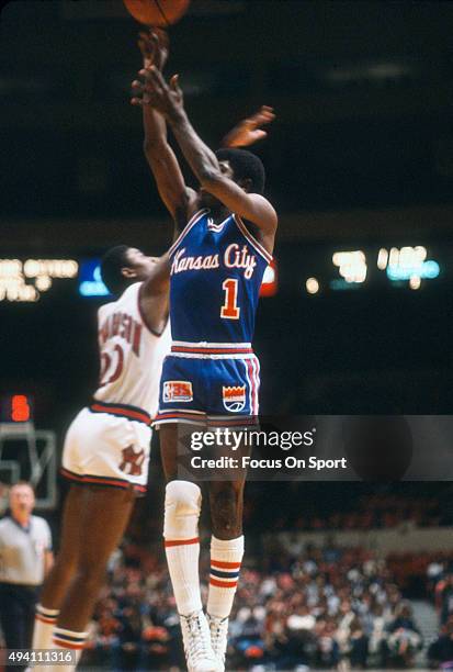 Phil Ford of the Kansas City Kings shoots over Michael Ray Richardson of the New York Knicks during an NBA basketball game circa 1981 at Madison...