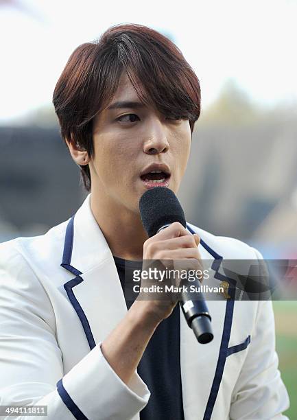 Korean singer Jung Yong-hwa sings the Korean national anthem before the game between the Los Angeles Dodgers and Cincinnati Reds on May 27, 2014 in...