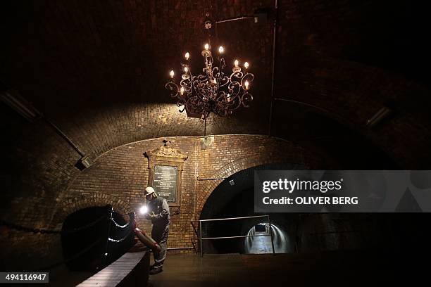 Worker of the urban drainage company walks through the so-called candelabra hall of the canalisation system of the city of Cologne, western Germany,...