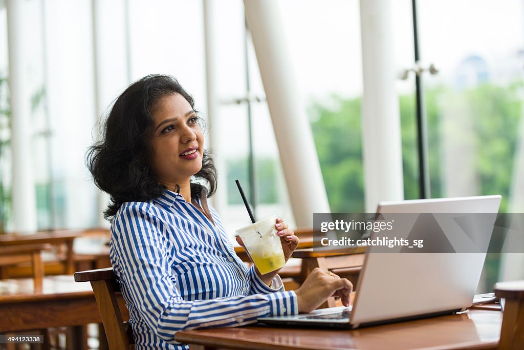 Attractive Asian Business Woman Working Away From Office