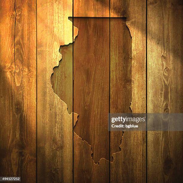 illinois map on lit wooden background - sunshine state stock illustrations