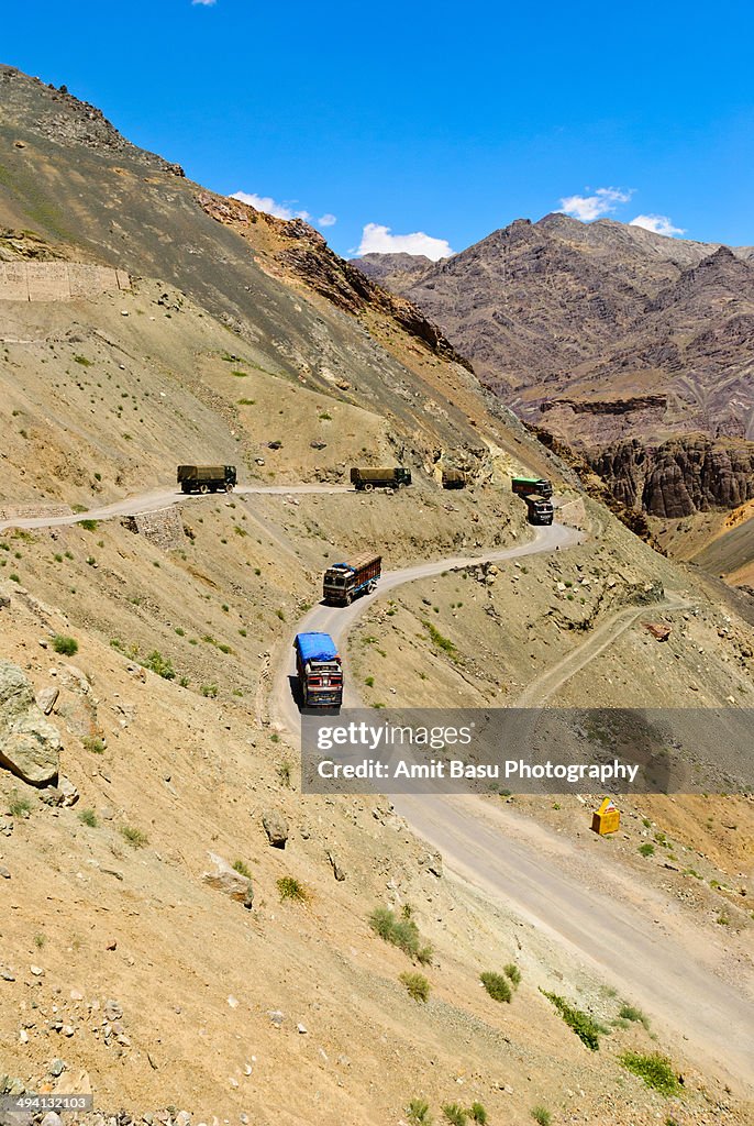 Trucks on high mountain pass. Ladakh, India