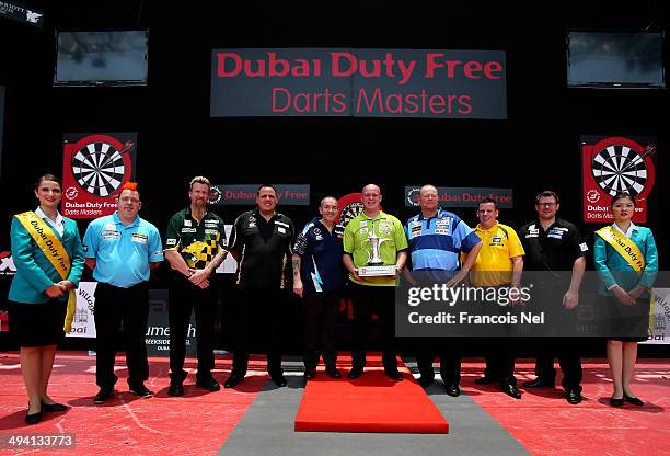 Peter Wright, Simon Whitlock, Adrian Lewis, Phil Taylor, Michael Van Gerwen, Raymond Van Barneveld, Dave Chisnall and James Wade pose for a...