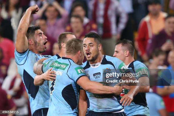 James Tamou, Trent Hodkinson and Jarryd Hayne of the Blues celebrate after winning game one of the State of Origin series between the Queensland...