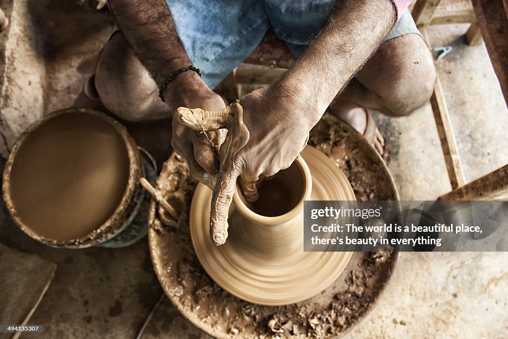 A potter making an earthen pot
