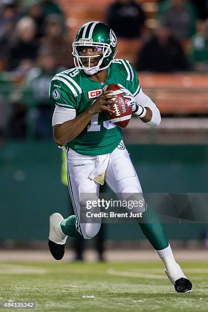 Quarterback Keith Price of the Saskatchewan Roughriders rolls out of the pocket in the game between the Edmonton Eskimos and Saskatchewan Roughriders...