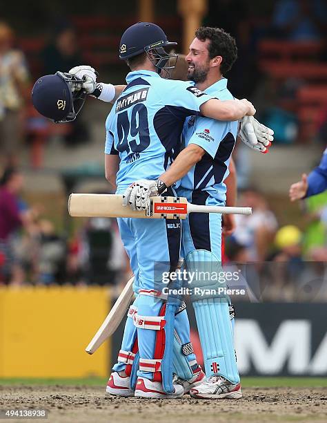 Steve Smith and Ed Cowan of the Blues celebrate after hitting the winning runs during the Matador BBQs One Day Cup final match between New South...