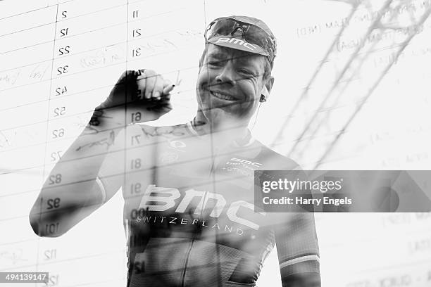 Cadel Evans of Australia and BMC Racing Team signs on ahead of the seventeenth stage of the 2014 Giro d'Italia, a 208km stage between Sarnonico and...