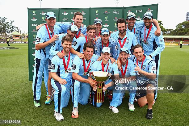 Blues captain Steve Smith and team mates pose with the Matador Cup after winning the Matador BBQs One Day Cup final match between New South Wales and...