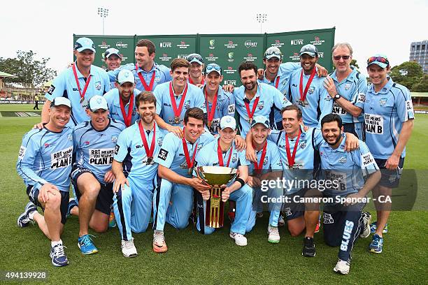 Blues captain Steve Smith and team mates pose with the Matador Cup after winning the Matador BBQs One Day Cup final match between New South Wales and...