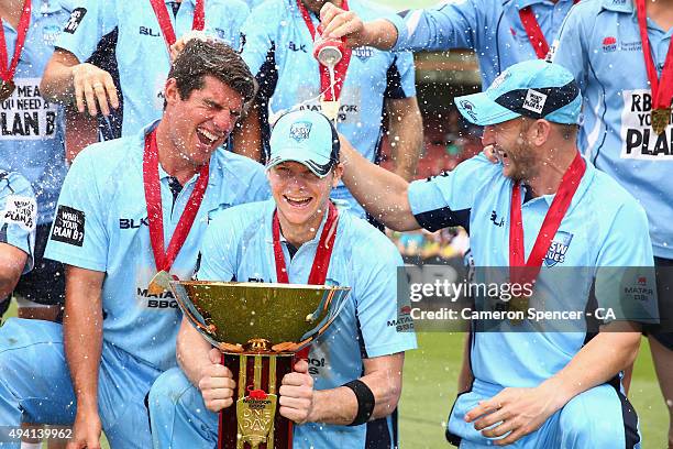 Blues captain Steve Smith and team mates pose with the Matador Cup after winning the Matador BBQs One Day Cup final match between New South Wales and...