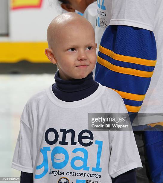 Carly's Club member Matthew Eggers takes part in ceremonies prior to the NHL game between the Buffalo Sabres and New Jersey Devils on Hockey Fights...