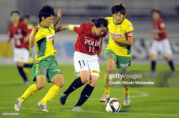 Michi Goto of Urawa Reds Ladies and Mari Kawamura of JEF United Chiba Ladies compete for the ball during the Nadeshiko League match between Urawa Red...