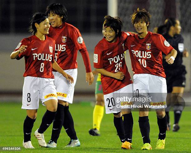 Chinatsu Kira of Urawa Reds Ladies celebrates scoring her team's first goal with her team mates during the Nadeshiko League match between Urawa Red...