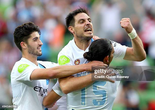 Bruno Fornaroli of City is congratulated by Paulo Retre and David Williams after scoring a goal during the round three A-League match between...