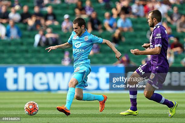Mate Dugandzic of Adelaide controls the ball against Gyorgy Sandor of the Glory during the round three A-League match between Perth Glory and...