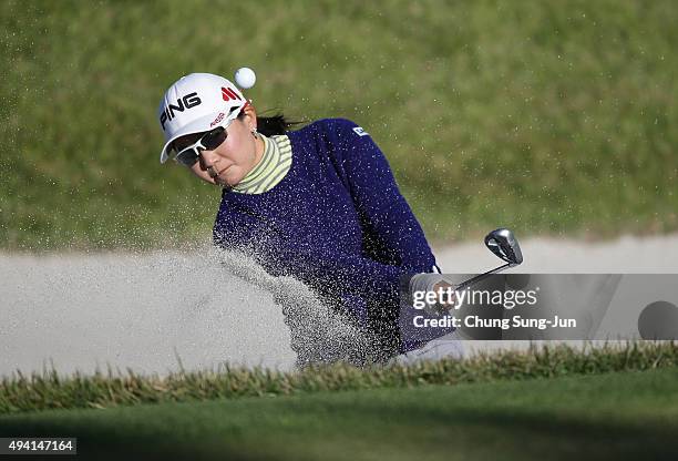 Ayako Uehara of Japan plays a bunker shot on the 1st hole during the final round of the Nobuta Group Masters GC Ladies at the Masters Gold Club on...