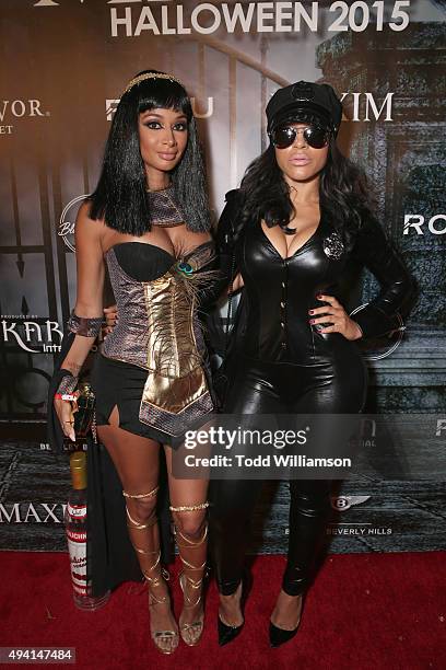 Personality Draya Michele and guest attend the Maxim Halloween Party Presented By Karma International on October 24, 2015 in Los Angeles, California.